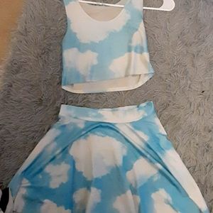 Cropped top with a knee length skirt with a nice blue sky and cloud design